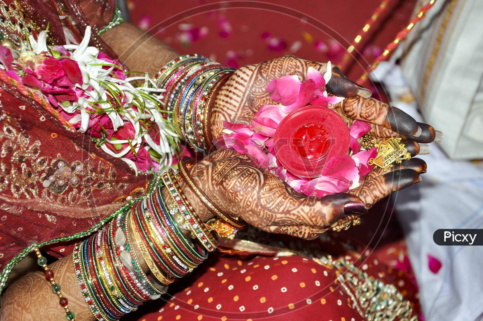 Indian Wedding Rituals With Flower On Hands.