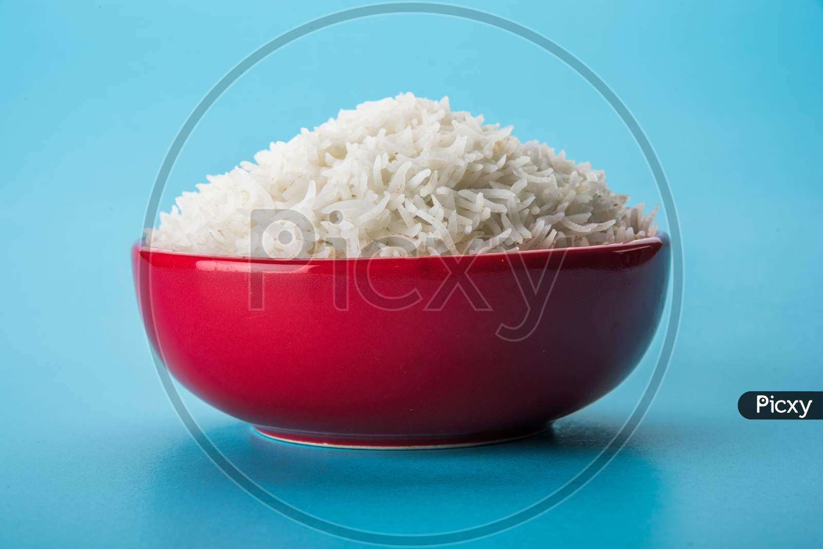 Cooked plain white basmati rice in ceramic bowl