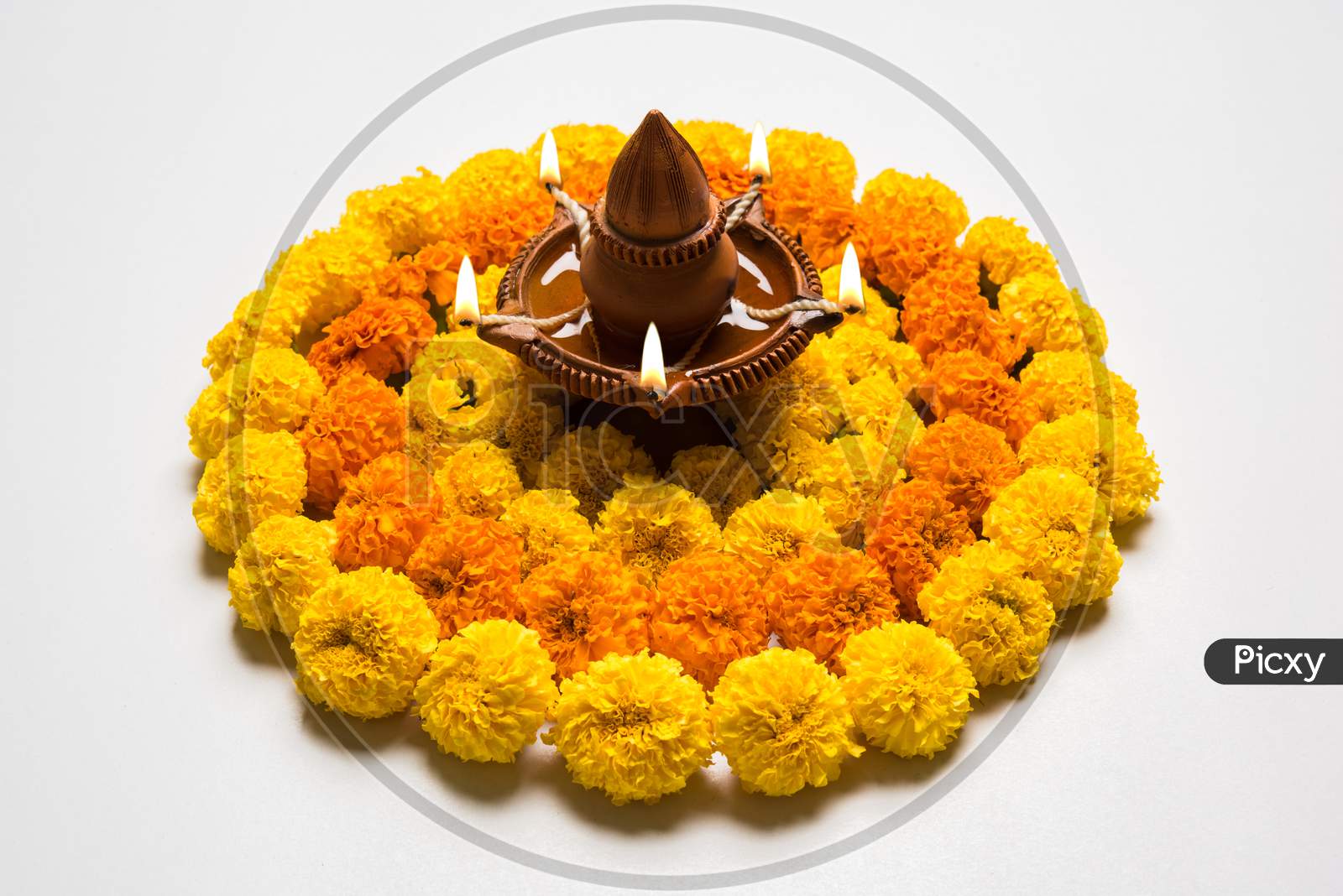 flower rangoli with diya for diwali celebration