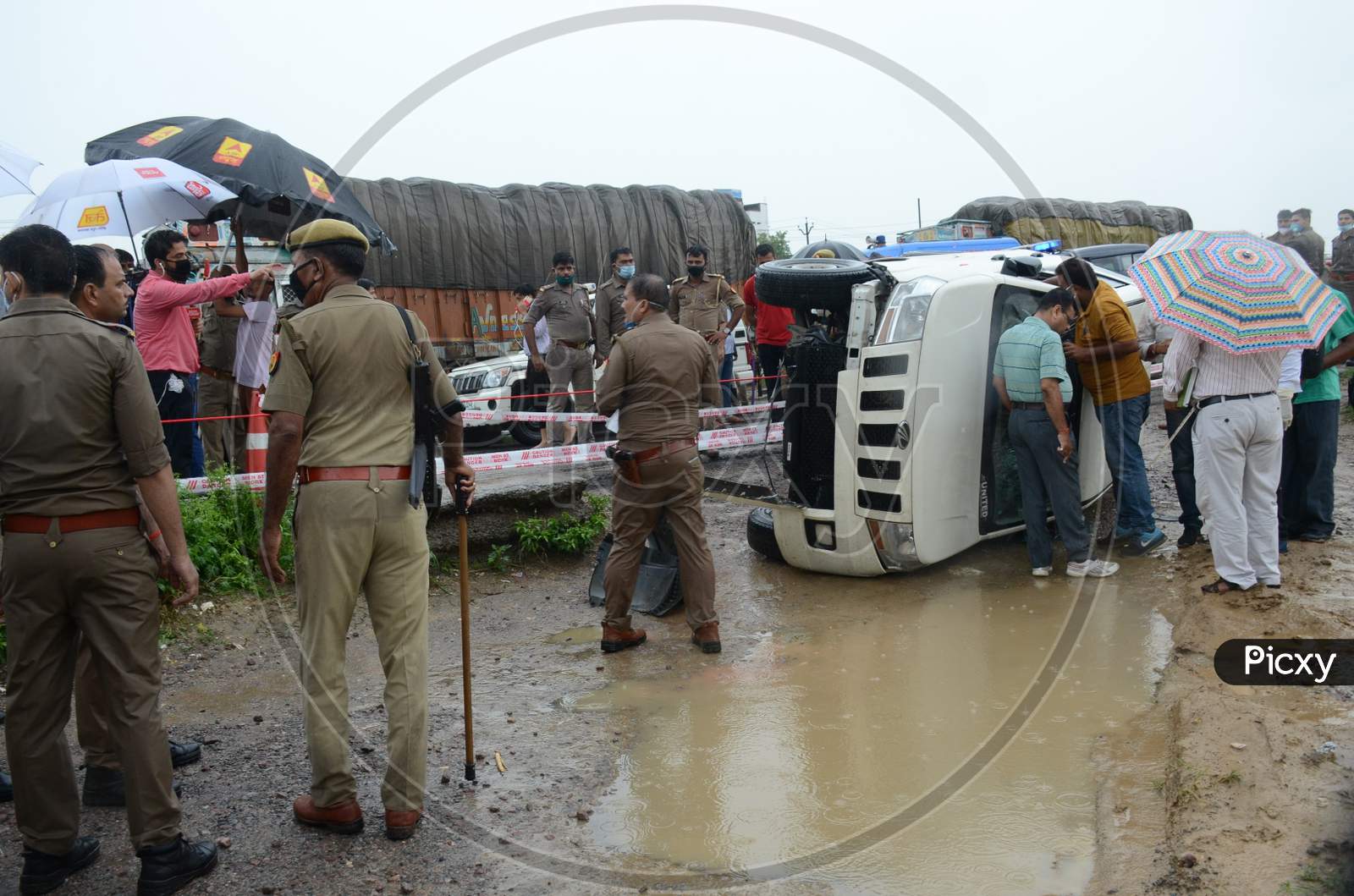 Police officials inspect the site of encounter where gangster Vikas Dubey was killed when he tried to escape from police custody in Kanpur, Uttar Pradesh on July 10, 2020