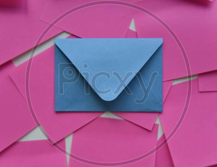 Selective Focus, Blue Envelope In The Middle Of Pink Stickers