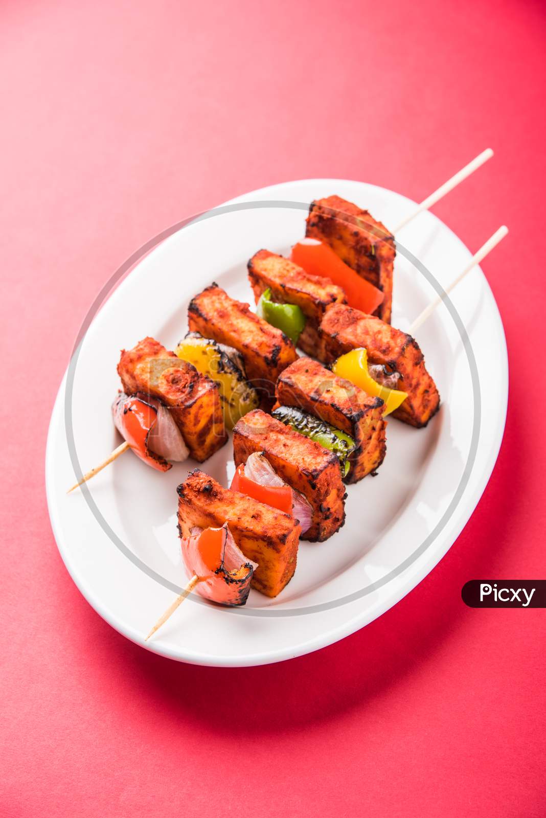 Chilli Paneer Tikka Kabab in red sauce made in Barbeque or Tandoor