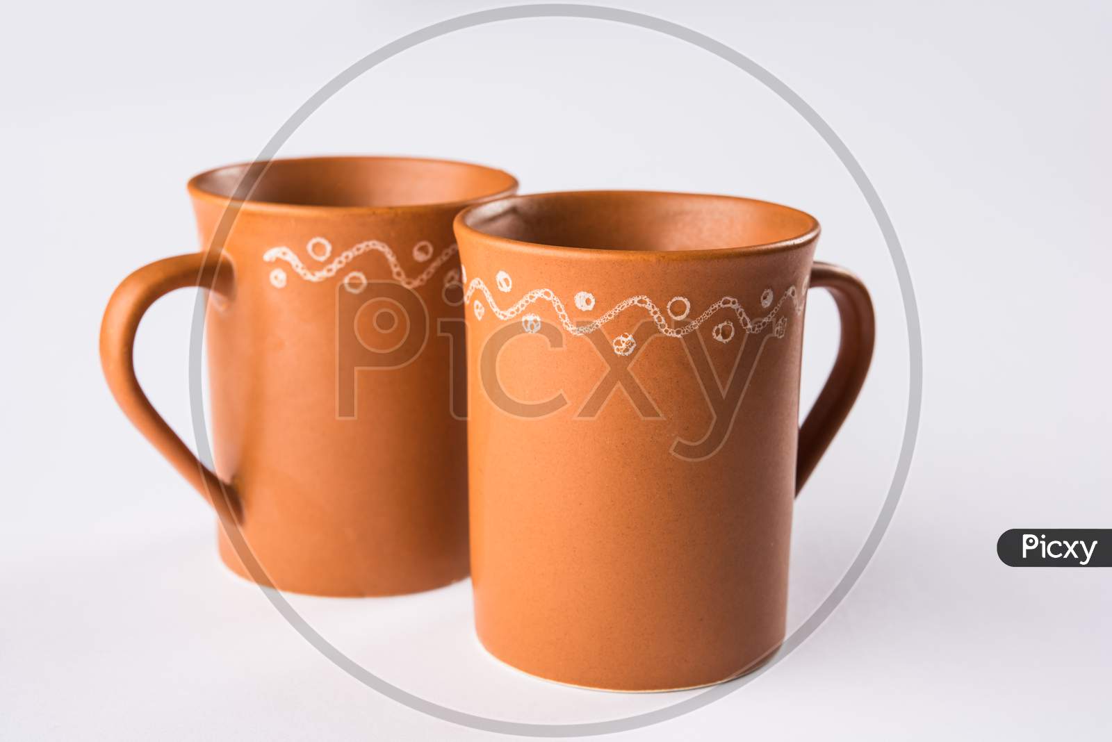 Empty terracotta mug or brown clay coffee cup or jar or drinking glass, isolated over white