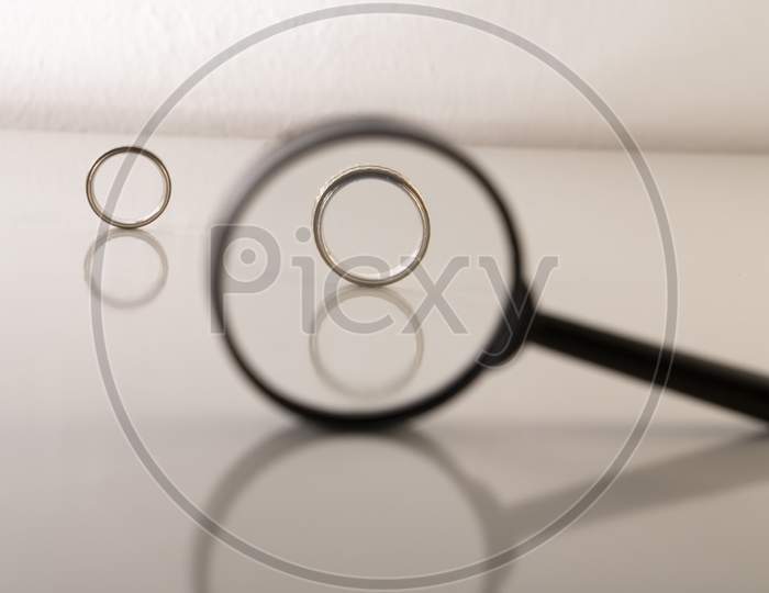 rings  with magnifying glass