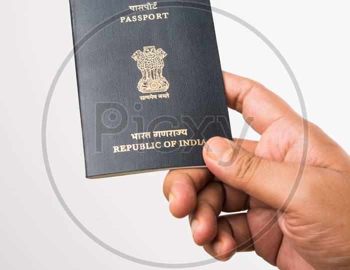 Hand holding Indian Passport