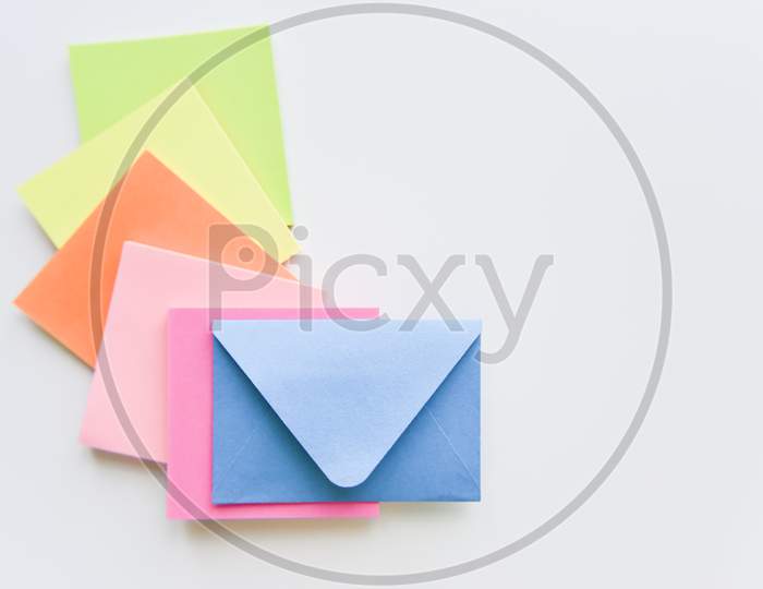 Selective Focus, Blue Envelope In The Center With Colored Rectangles Spreading Under It