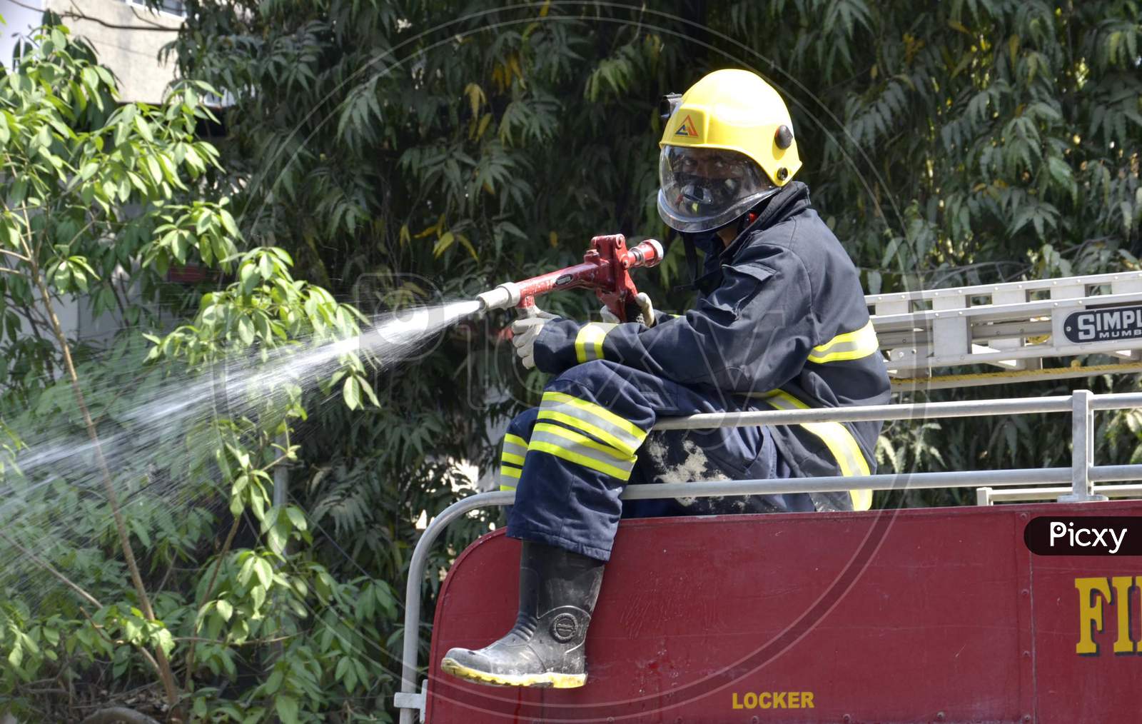 Fire-Fighters Spray Disinfectants On Streets To Contain The Spread Of Coronavirus During The Nationwide Lockdown, In Guwahati On Monday, 06 April 2020.Photo:Hafiz Ahmed