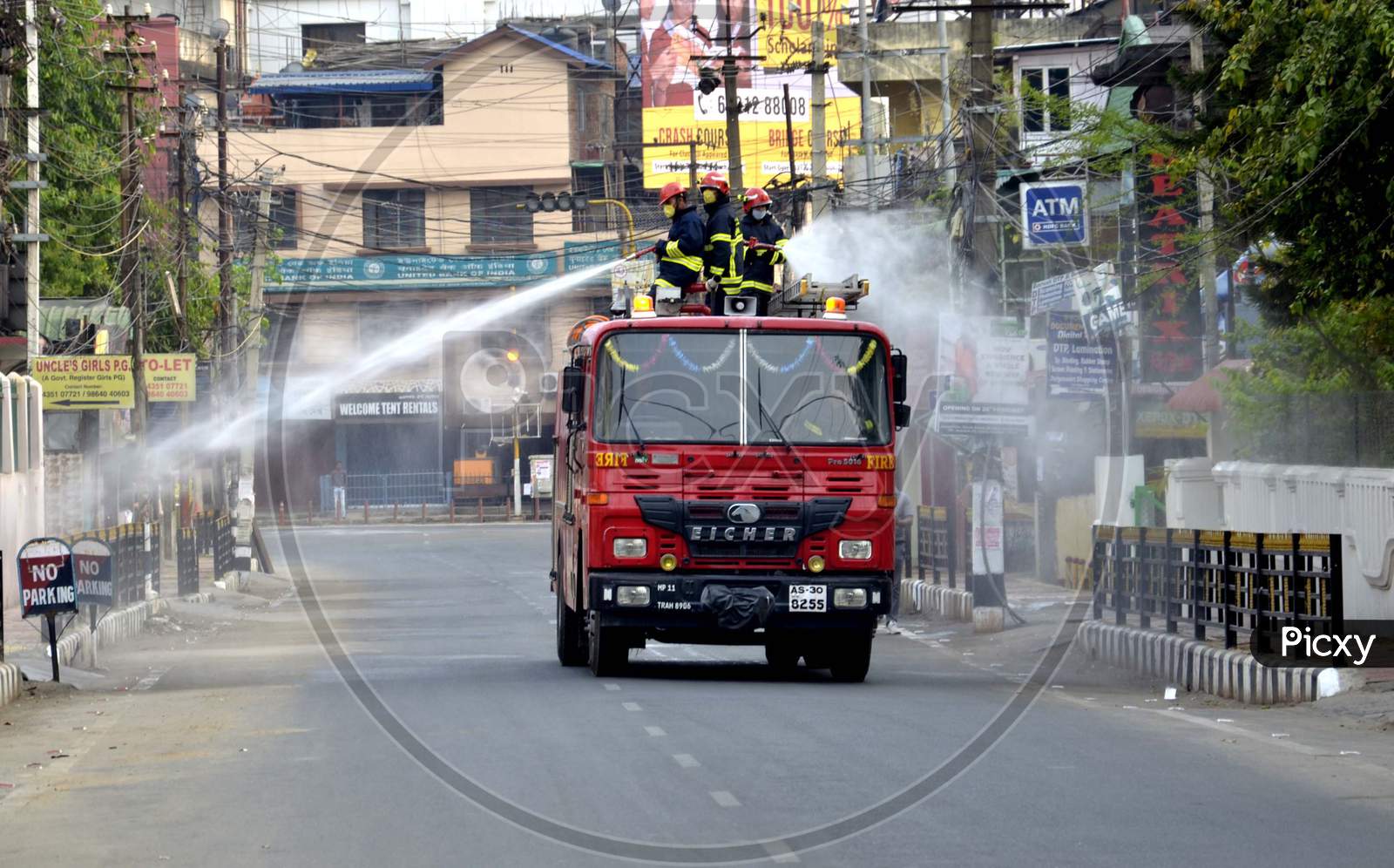 Assam State Fire and Emergency Service worker spray disinfectants