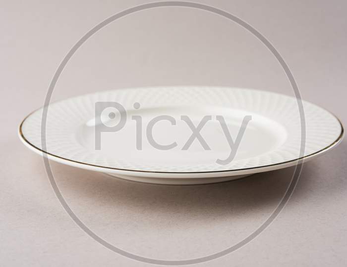 Empty white ceramic round plate