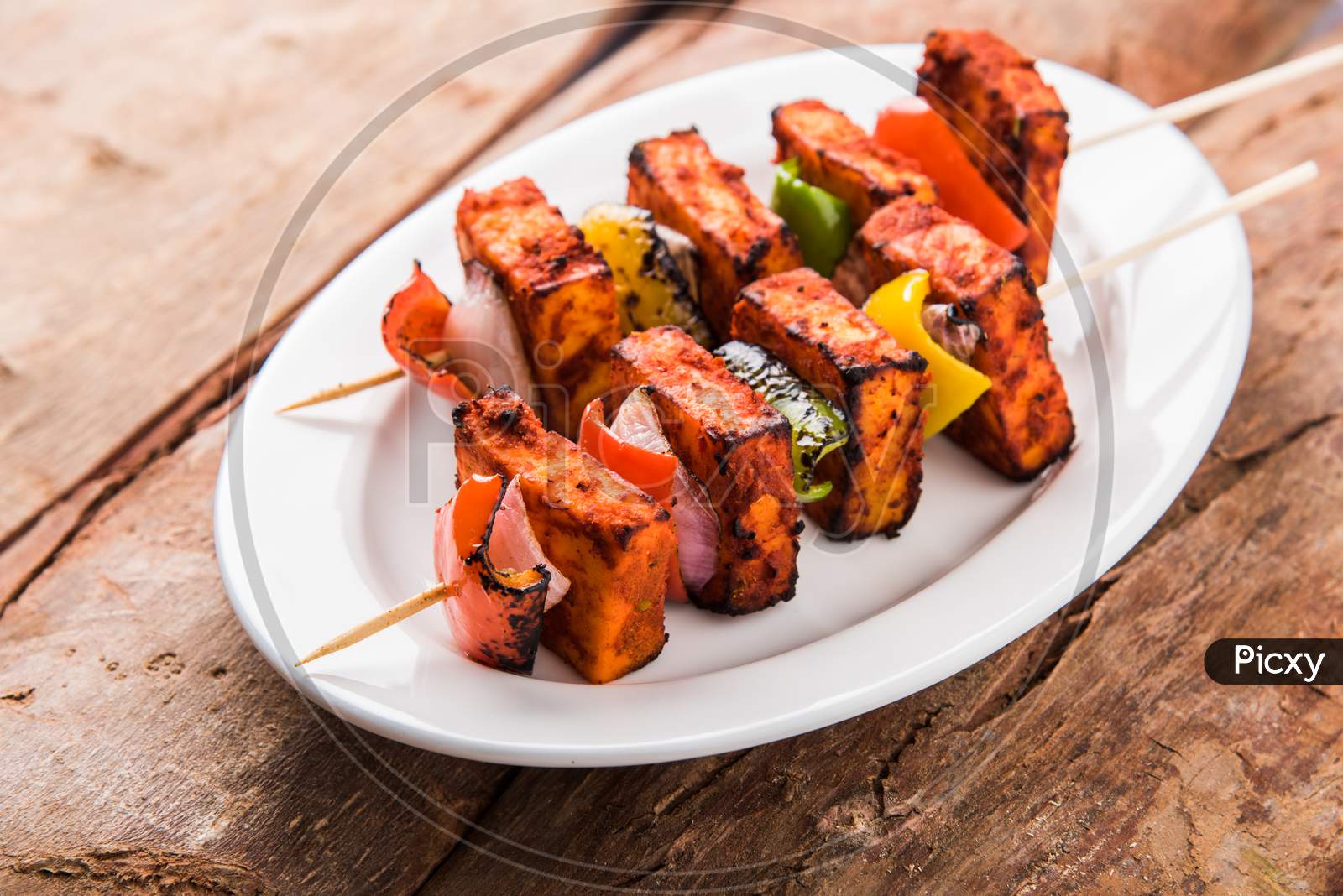 Chilli Paneer Tikka Kabab in red sauce made in Barbeque or Tandoor