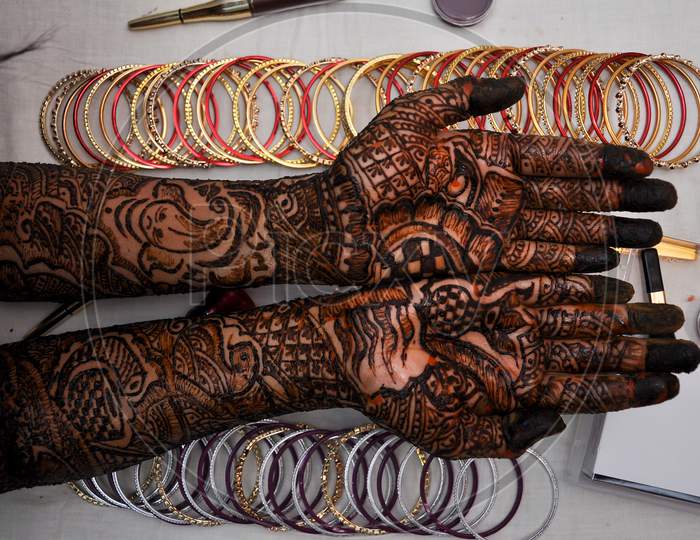 Woman Hand With Black Henna Tattoo On Jewelry.