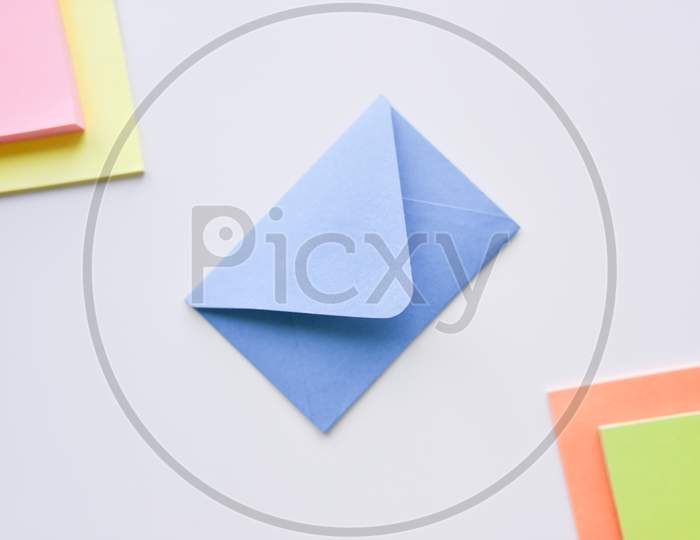 Selective Focus, Blue Envelope In The Center With Colored Rectangles In Corners