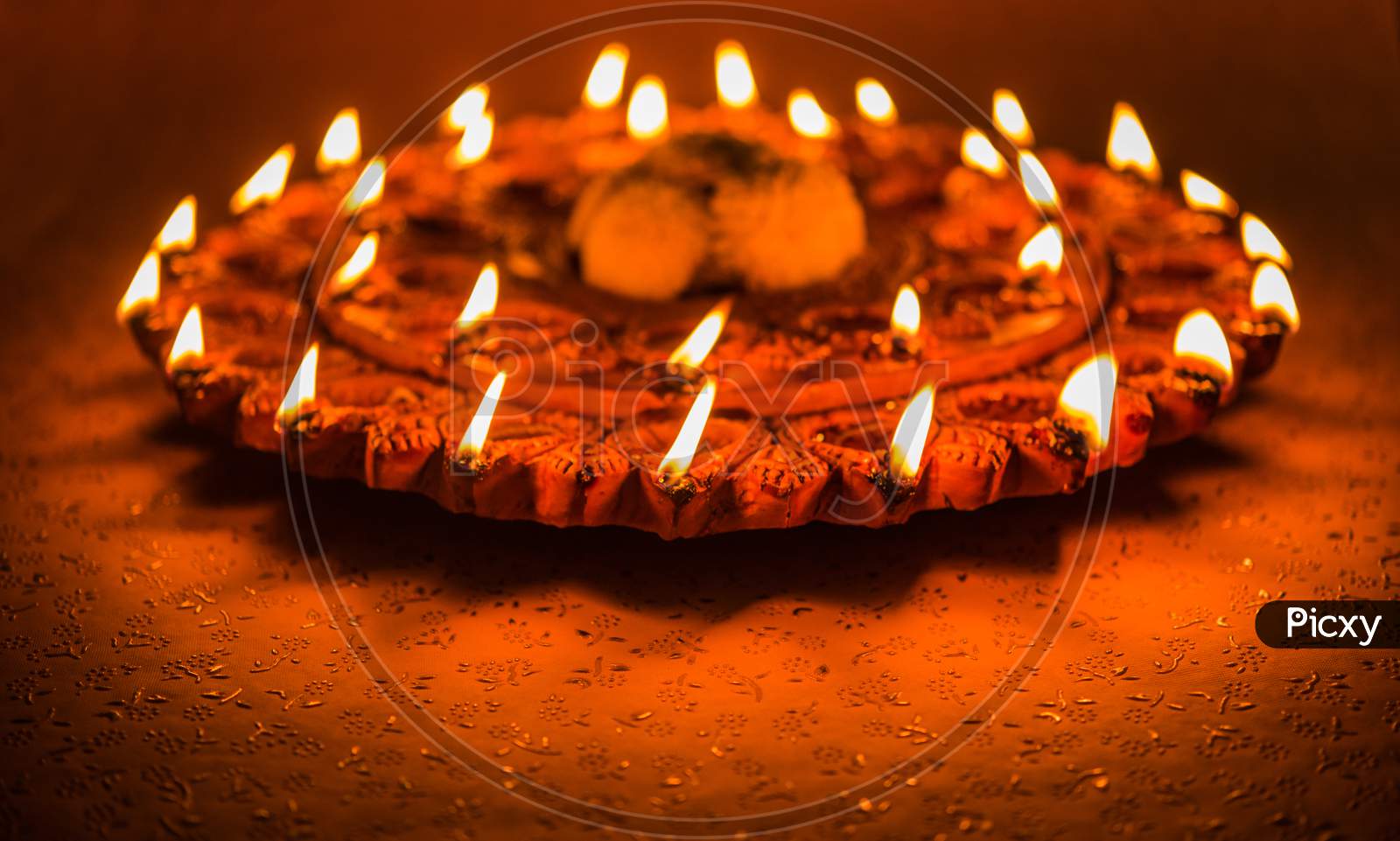 Beautiful illuminated terra-cotta Diwali diya Plate