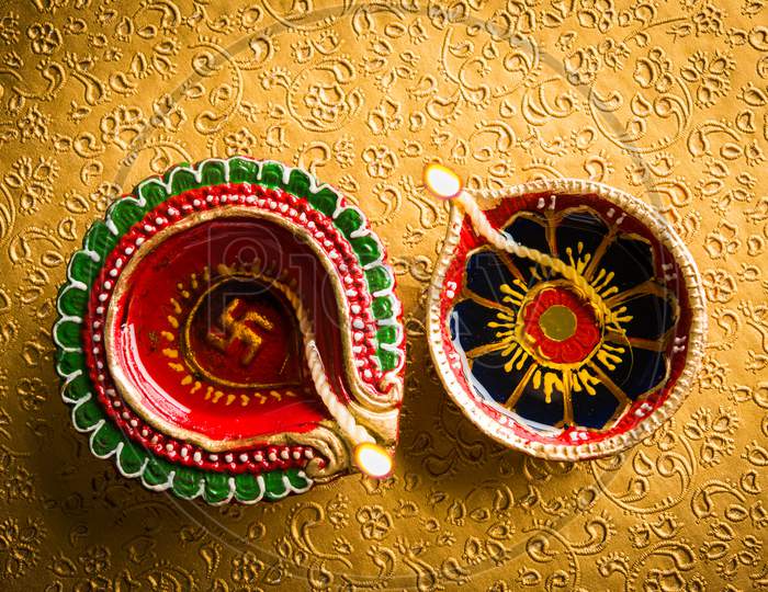 beautiful diwali diya or oil lamp with gifts