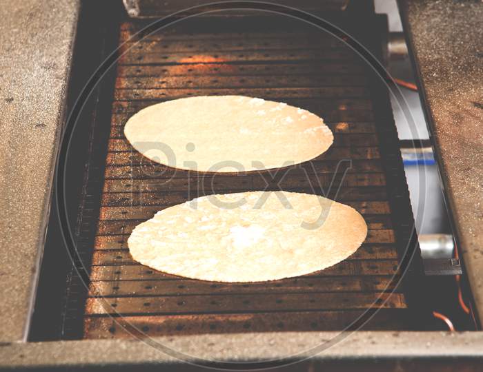 Roti or chapati making machine, selective focus
