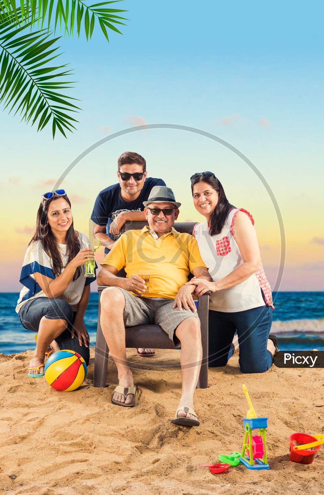 Indian  Family enjoying at beach, posing for picture