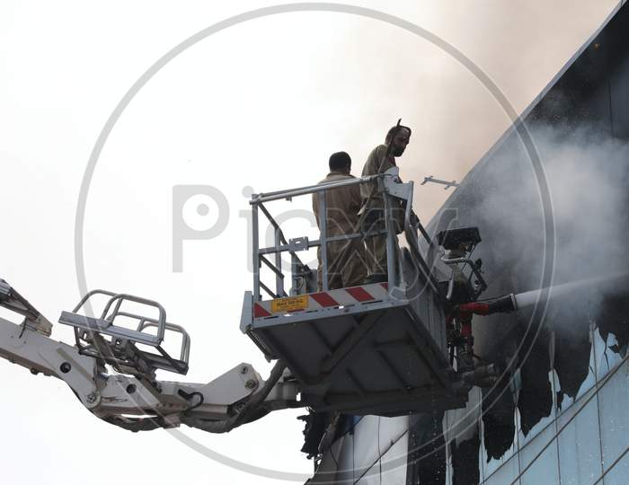 Firefighters in action after a fire broke out in Bakshi Nagar in Jammu on July 10, 2020