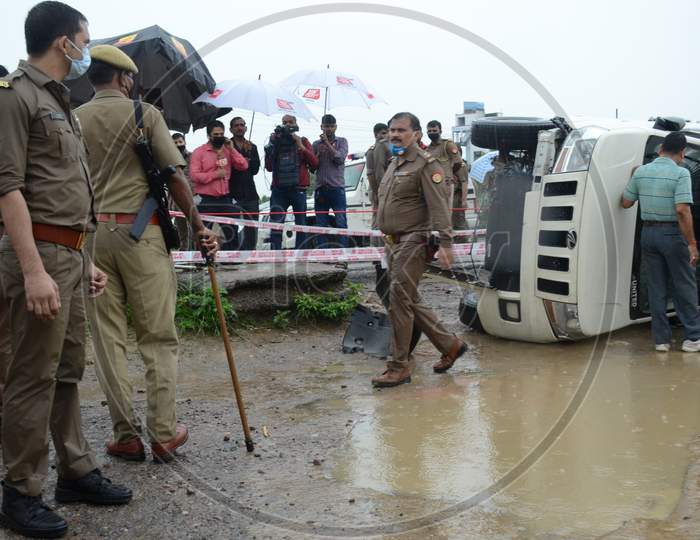 Police officials inspect the site of encounter where top criminal Vikas Dubey was killed when he tried to escape from police custody in Kanpur, Uttar Pradesh on July 10, 2020