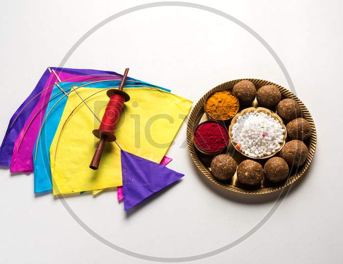 Happy Makar Sankranti - tilgul, patang or kite with haldi kumkum