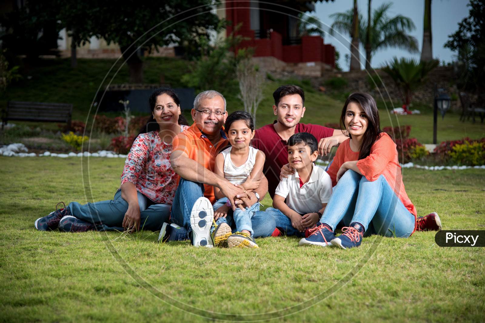 Indian family sitting outdoor