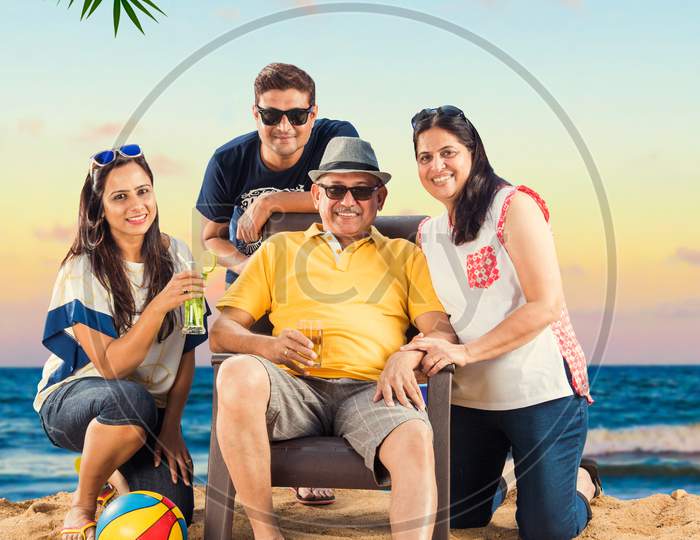 Indian  Family enjoying at beach, posing for picture