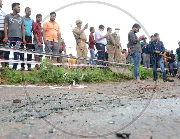 Bystanders at the site of the encounter where gangster Vikas Dubey who was killed when he tried to escape from police custody in Kanpur, Uttar Pradesh on July 10, 2020