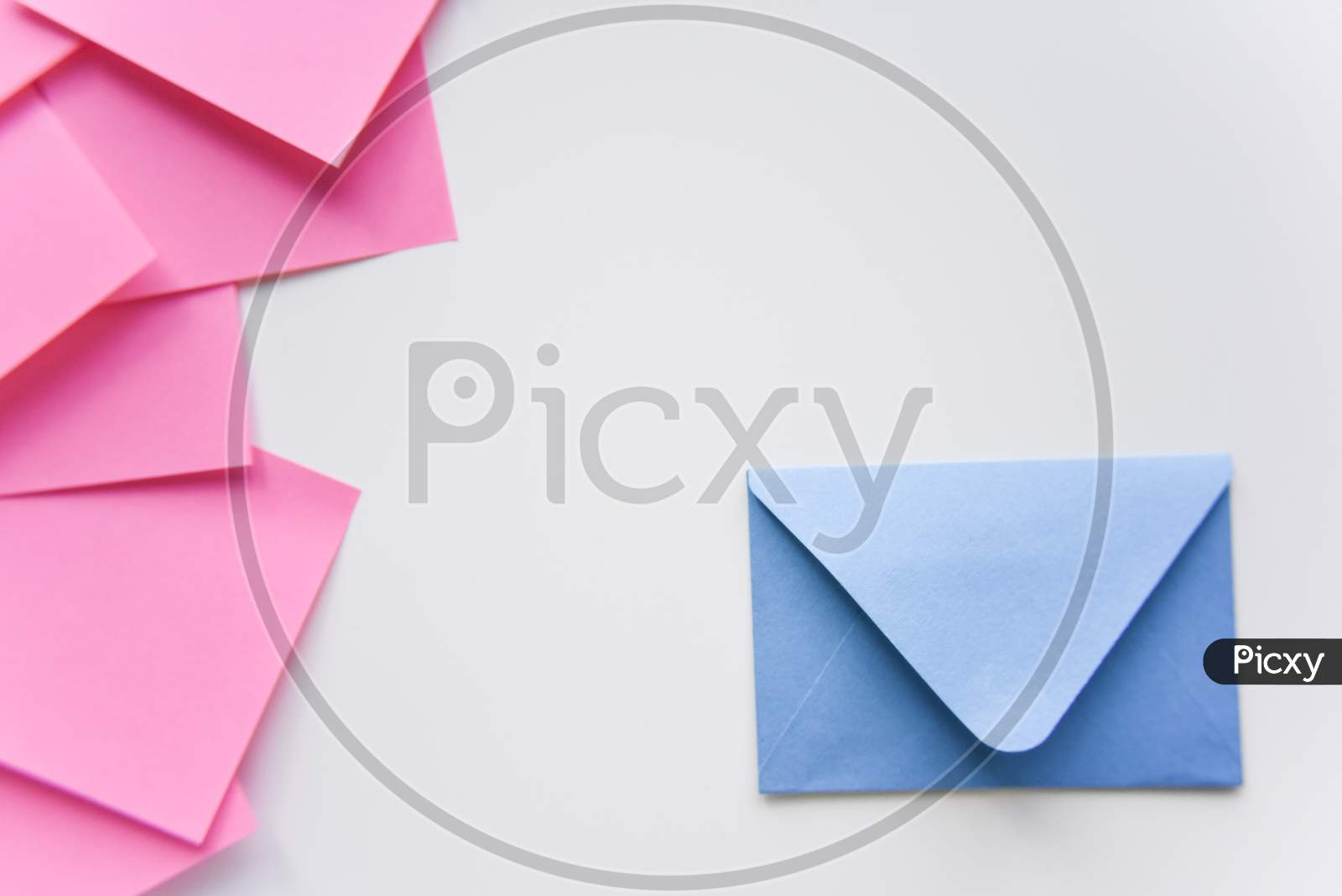 Selective Focus, Blue Envelope In The Corner And Pink Stickers On The Side