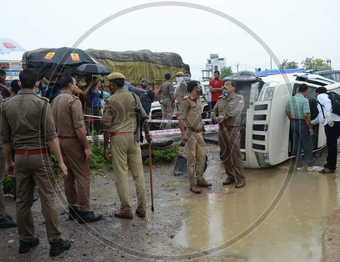 Police officials inspect the site of encounter where gangster Vikas Dubey was killed when he tried to escape from police custody in Kanpur, Uttar Pradesh on July 10, 2020