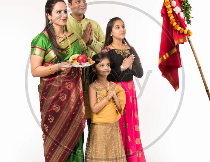 Indian family celebrating Gudi Padwa or Ugadi festival which is a hindu new year