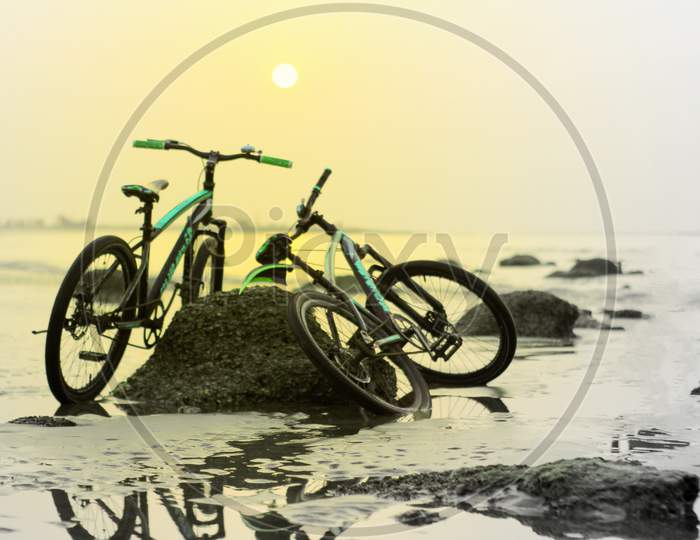 Bicycle In Background Beautiful Sea Beach Nature Sunset.