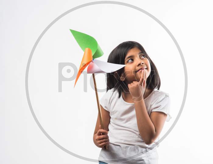 Cute Indian girl holding flag or tricolour