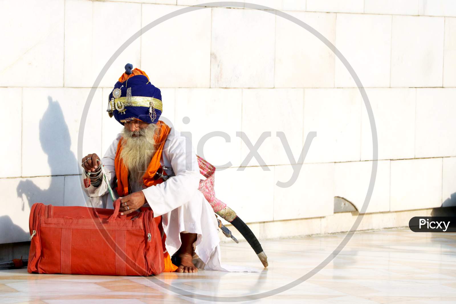 Amritsar, India - December 03, 2019: Unidentified Sikh Man Visiting The Golden Temple In Amritsar, Punjab, India. Sikh Pilgrims Travel From All Over India To Pray At This Holy Site.