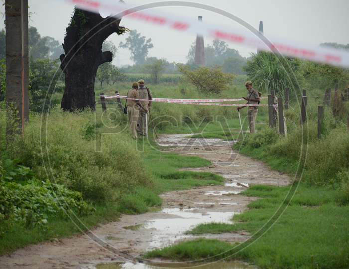 Police officials seal the site of encounter where gangster Vikas Dubey was killed when he tried to escape from police custody in Kanpur, Uttar Pradesh on July 10, 2020