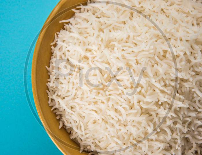 Cooked plain white basmati rice in ceramic bowl