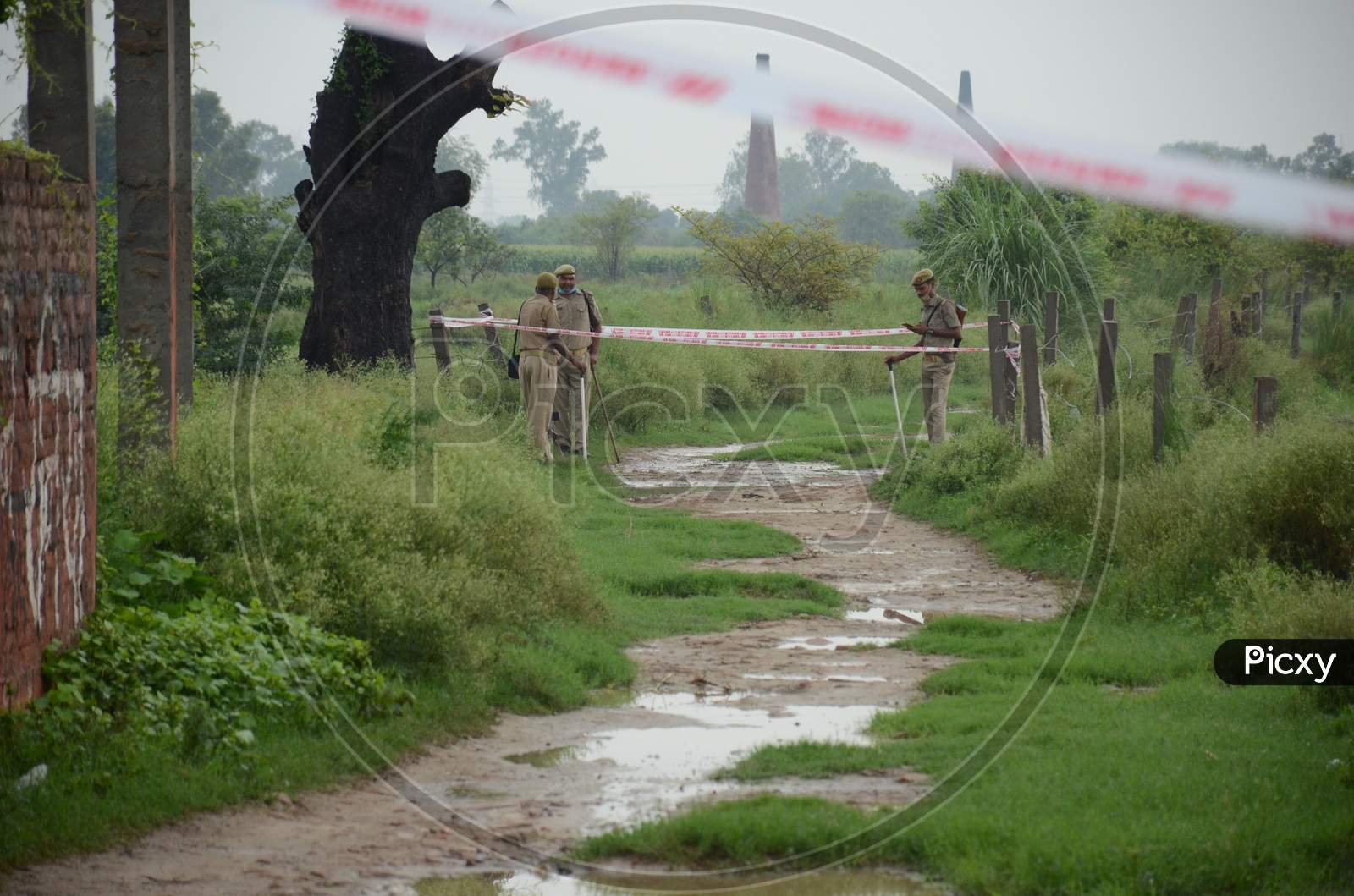 Police officials seal the site of encounter where gangster Vikas Dubey was killed when he tried to escape from police custody in Kanpur, Uttar Pradesh on July 10, 2020