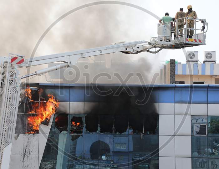 Firefighters in action after a fire broke out in Bakshi Nagar in Jammu on July 10, 2020