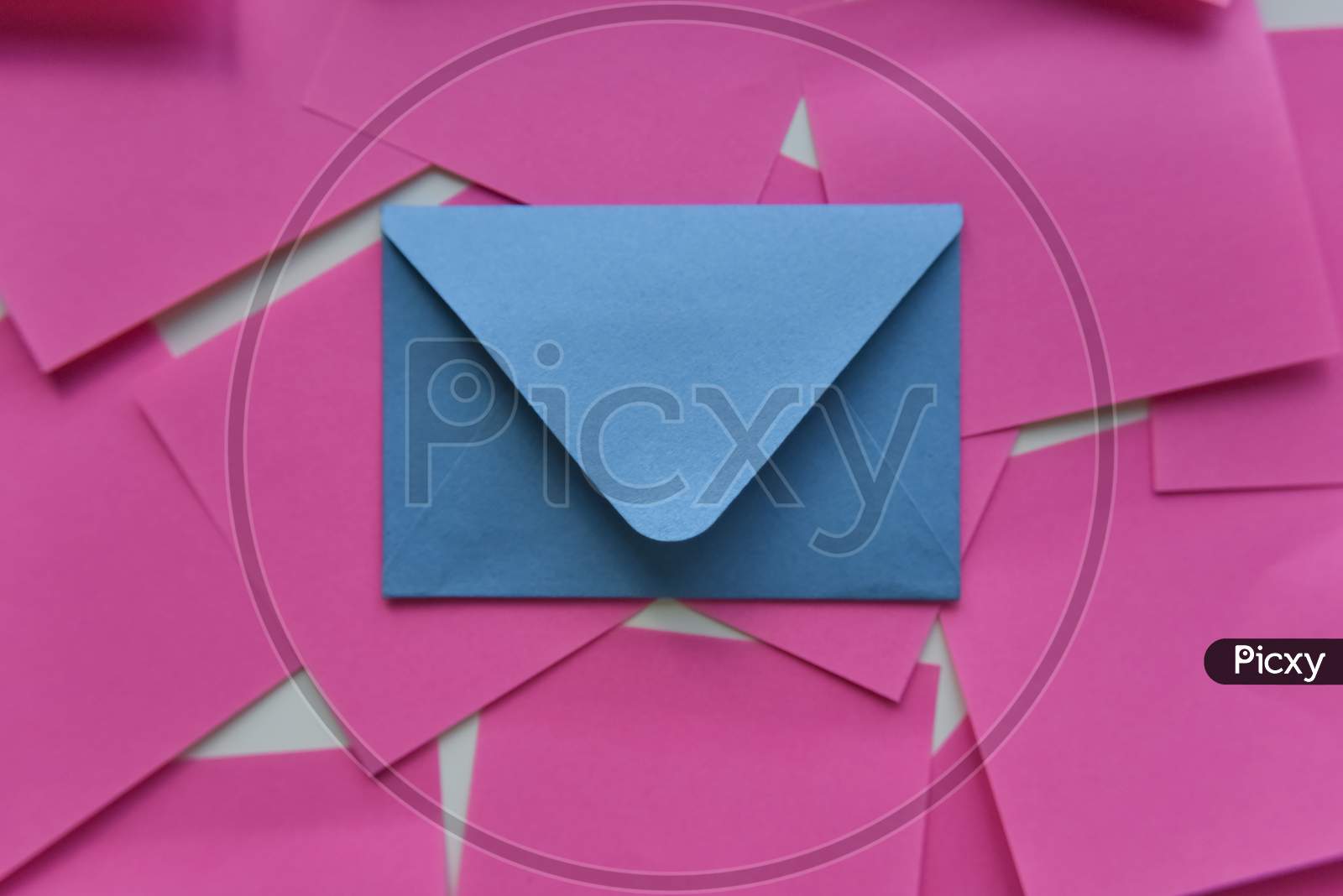 Selective Focus, Blue Envelope In The Middle Of Pink Stickers