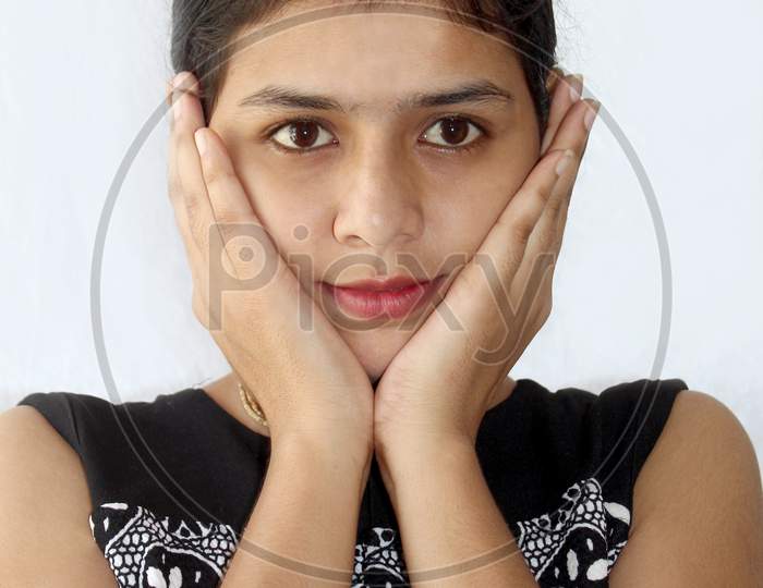 Young Women Is Touching Her Face
