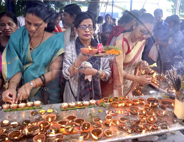 Devotees lighting  the earthen lamp to offer prayers to Lord Ganesha on the occasion of the 'Ganesh Chaturthi' festival
