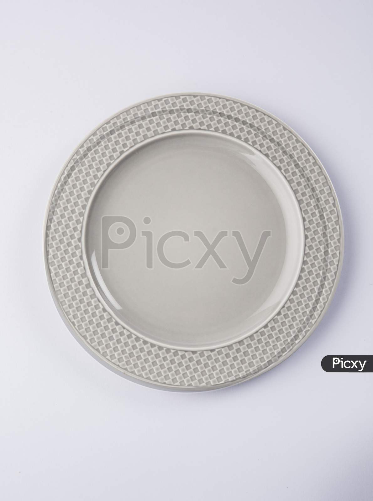 Empty grey ceramic round plate