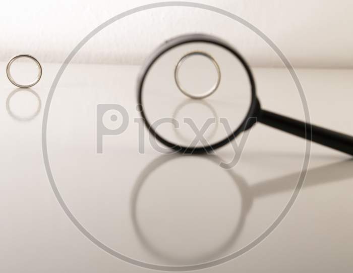 rings  with magnifying glass