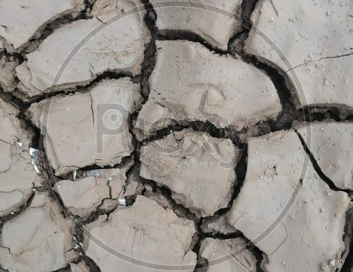 dry land - earth cracks in  agricultural land