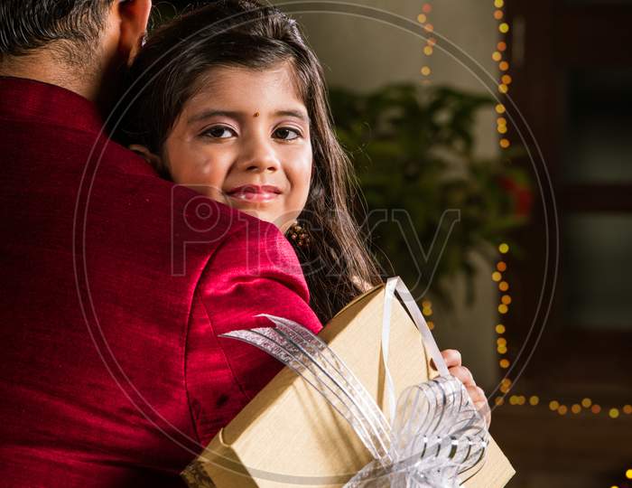 Indian mother and daughter celebrating diwali festival