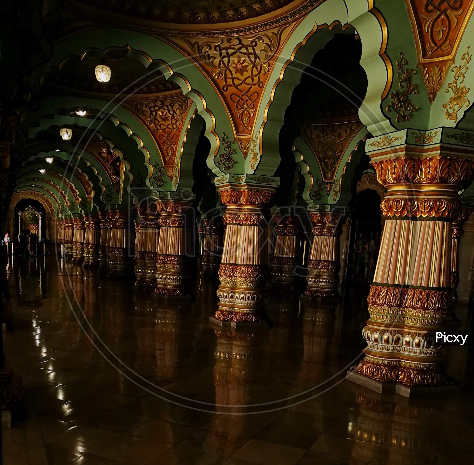Pillars of a palace and its reflection on the floor with beautiful architecture work