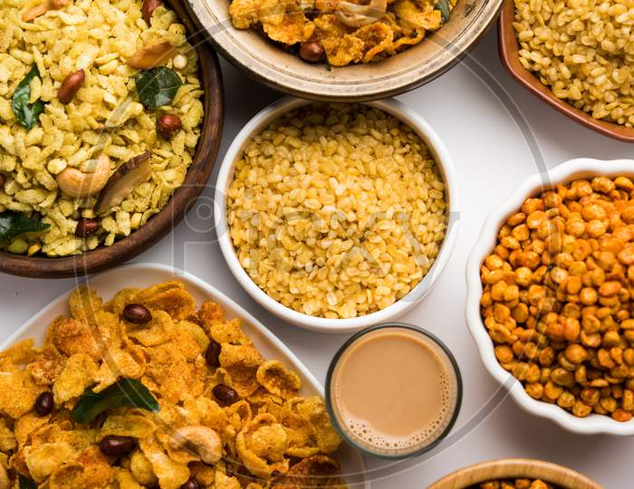 Group of Cornflake and Thick Poha Chivda or Chiwda and Chatpata Masala chana and fried crispy Moong Dal, served in a bowl. selec