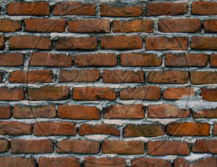 Old Brick Wall Uneven Texture. Grunge Red Vintage Background