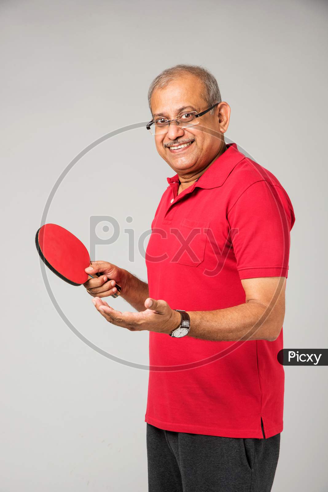 Senior indian man playing table tennis