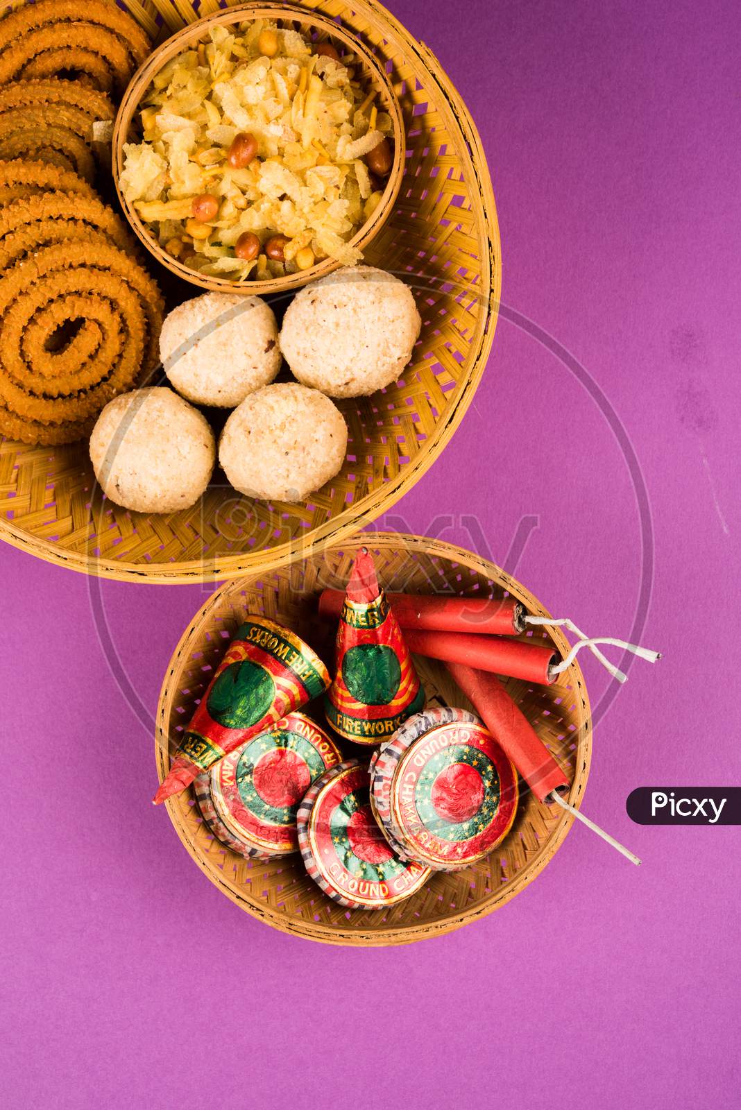 diwali food / snacks /sweets with fire crackers isolated