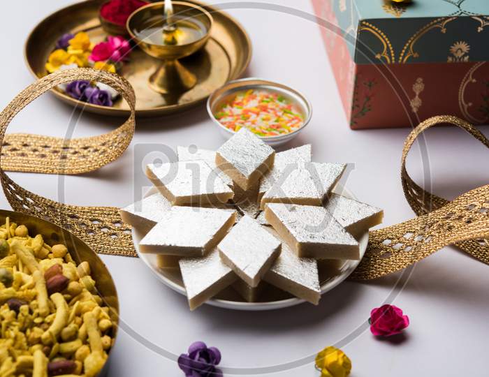 Raksha bandhan Festival : conceptual Rakhi made using plate full of sweets with band