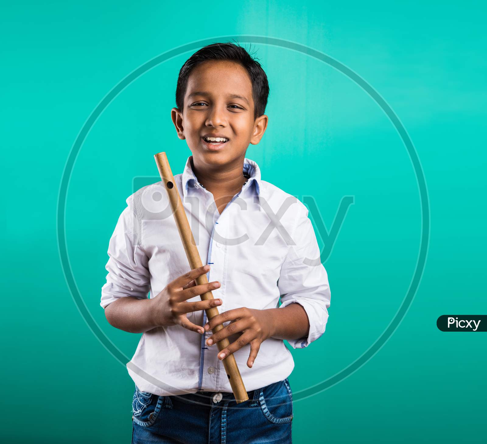 Little indian playing Flut / Basuri / Musical Instrument